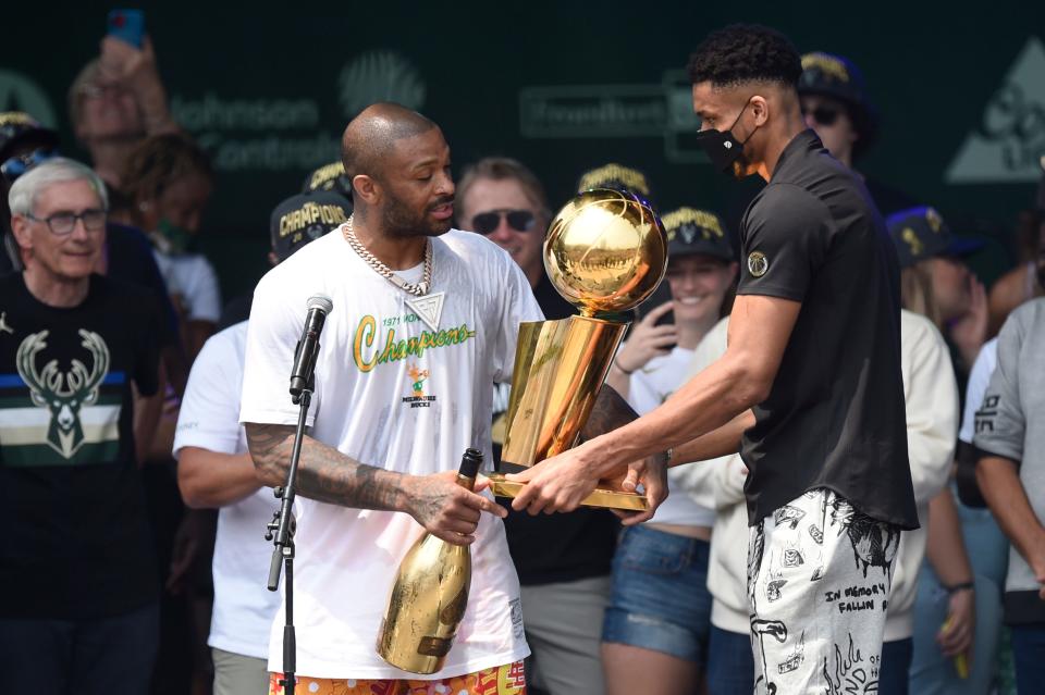 The acquisition of P.J. Tucker (left) near the trade deadline last season helped Giannis Antetokounmpo and the Bucks win the NBA title.