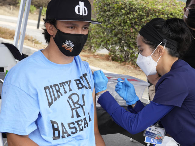 Nurse Anita Huang gives the Pfizer vaccine to Justin Mataalii during a vaccination clinic at Rio Hondo College in Whittier, Calif. (Keith Birmingham/MediaNews Group/Pasadena Star-News via Getty Images)