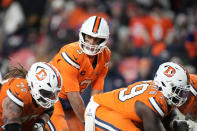 Denver Broncos quarterback Russell Wilson (3) waits on the snap during the second half of an NFL football game against the New England Patriots, Sunday, Dec. 24, 2023, in Denver. (AP Photo/David Zalubowski)