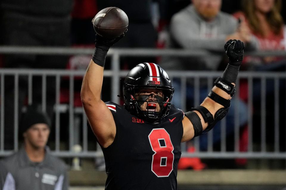 Sep 24, 2022; Columbus, Ohio, USA; Ohio State Buckeyes tight end Cade Stover (8) celebrates scoring a touchdown during the first half of the NCAA Division I football game against the Wisconsin Badgers at Ohio Stadium. Mandatory Credit: Adam Cairns-The Columbus Dispatch