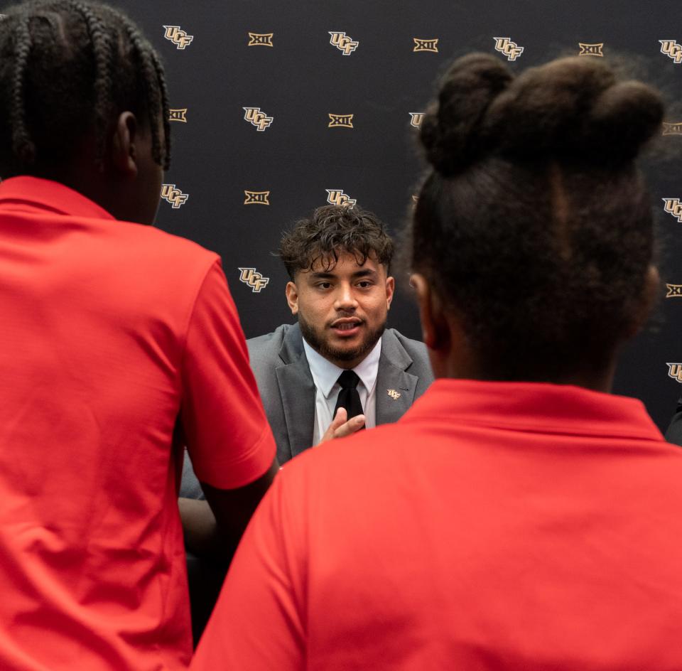 University of Central Florida offensive lineman Lokahi Pauole answers questions from children in the Big 12 Kid Reporter Program during a breakout press conference on the second day of Big 12 Media Days in AT&T Stadium in Arlington, Texas, July 13, 2023. 