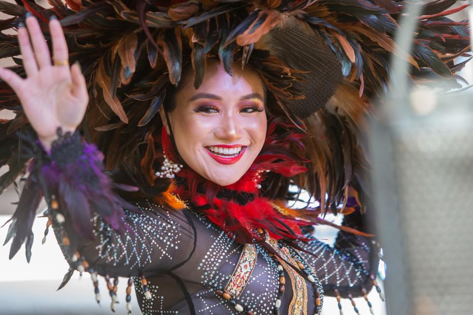 Asia Joy Espiritu Dising emcees the International Cultural Fashion Show at the Arizona Asian Festival while wearing a traditional Filipino dress on Oct. 22, 2022, in Scottsdale.