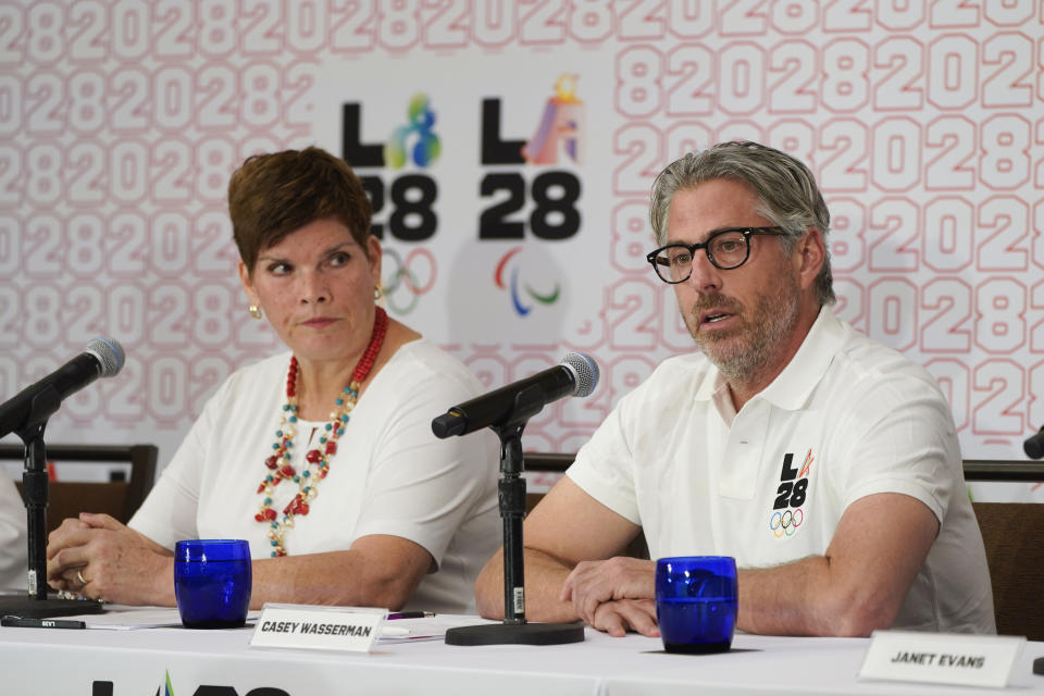 LA28 Chairperson Casey Wasserman, right, speaks during a news conference as he is joined by Nicole Hoevertsz, IOC member and LA28 coordination commission chair, Thursday, Sept. 15, 2022, in Los Angeles, updating their progress in planning the 2028 Los Angeles Olympics games. (AP Photo/Jae C. Hong)