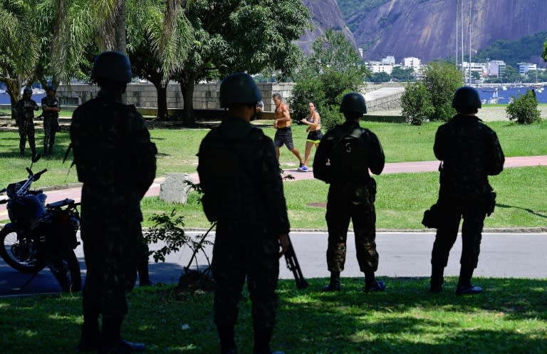 Soldiers stand guard along Flamengo beach, Rio de Janeiro, after President Michel Temer started implementing his decree giving the military full control over security in crime-plagued Rio