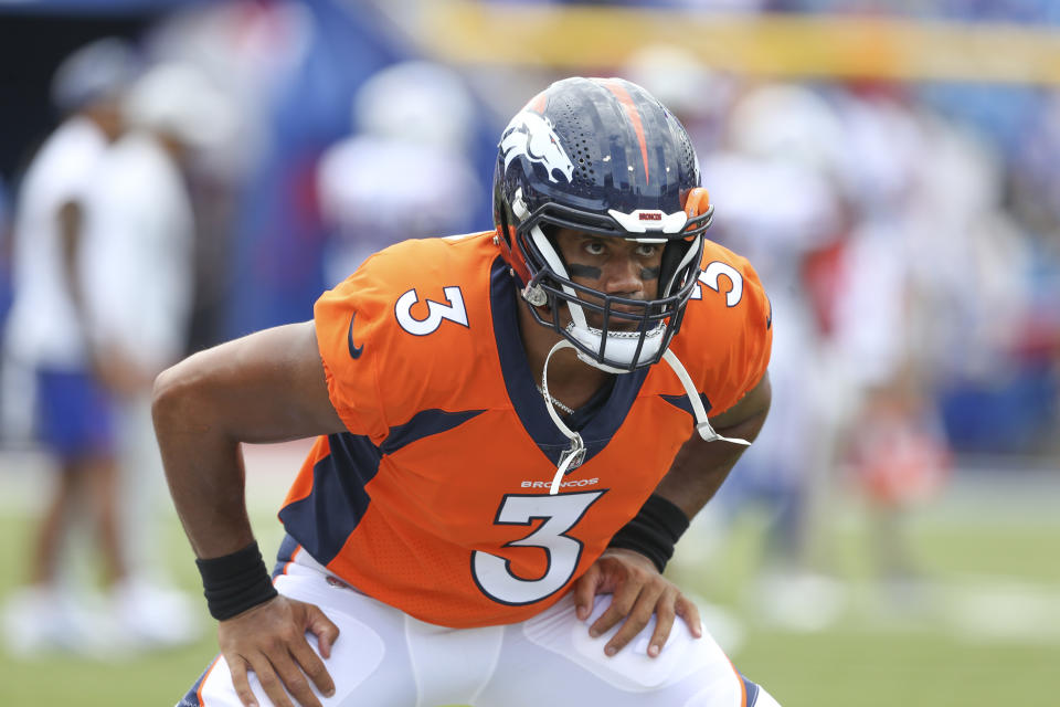 Denver Broncos quarterback Russell Wilson warm-up before a preseason NFL football game against the Buffalo Bills, Saturday, Aug. 20, 2022, in Orchard Park, N.Y. (AP Photo/Joshua Bessex)