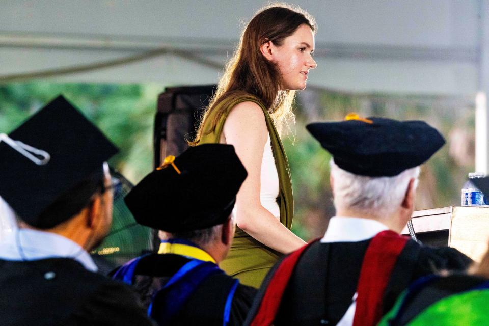 Former student body president Grace Keenan was met with a standing ovation for her remarks, ending with an homage to New College’s past mascot.