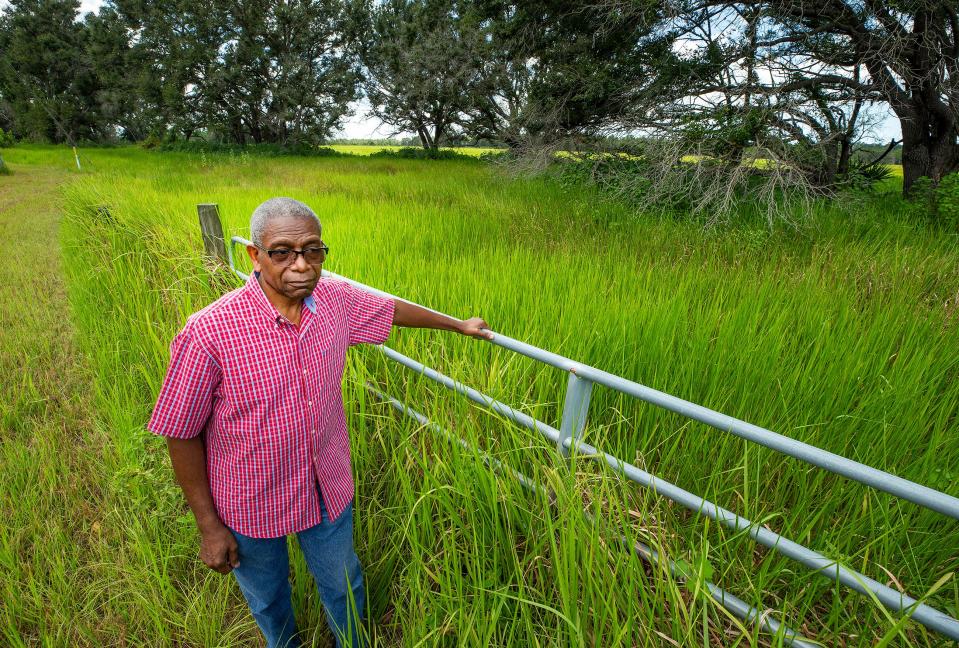 Pastor Eugene Kendrick stands next to property across the street from his home where an industrial site is being proposed. The owner is seeking a zoning change. But residents of the Rolling Hills neighborhood in Bradley say they're fed up with industrial development in their rural area.