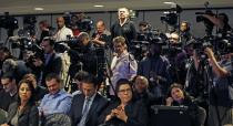 Journalists wait for NBA Commissioner Adam Silver to address a news conference in New York, Tuesday, April 29, 2014. Silver announced that Los Angeles Clippers owner Donald Sterling has been banned for life by the league in response to racist comments the league says he made in a recorded conversation. (AP Photo/Kathy Willens)