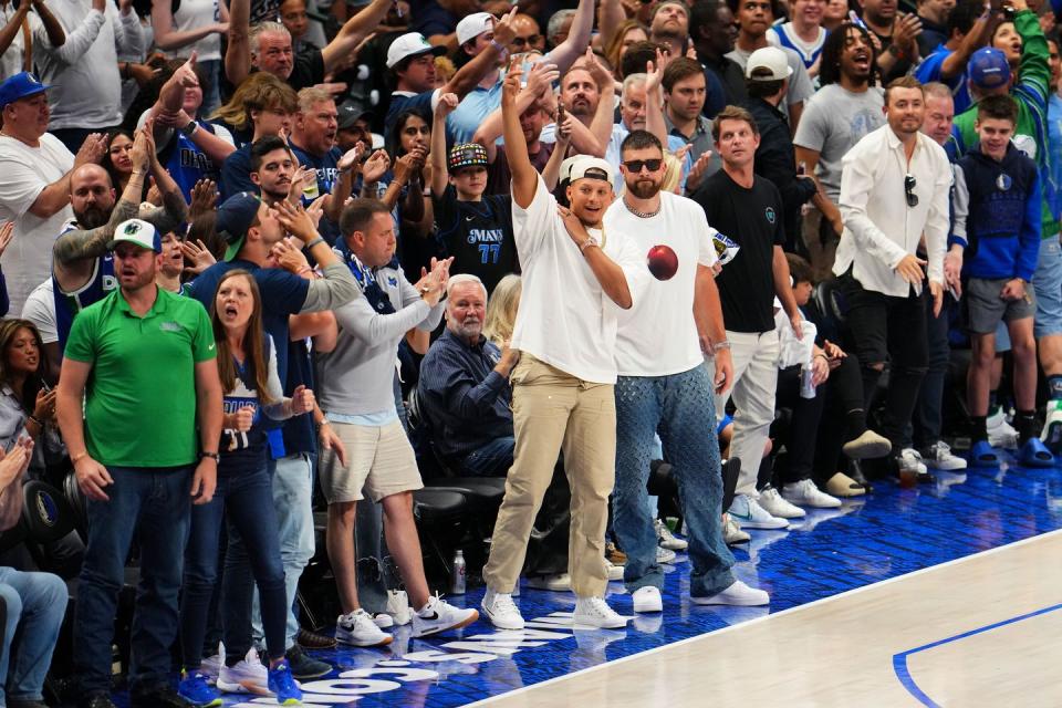 patrick mahomes and travis kelce at the dallas mavericks game on may 26, 2024