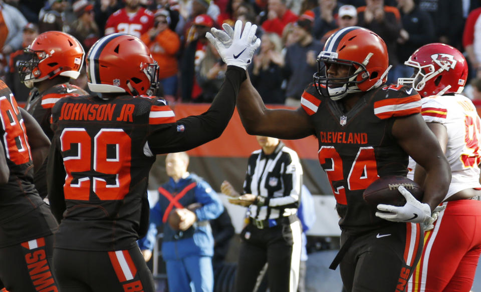 Cleveland Browns running back Nick Chubb (24) celebrates with running back Duke Johnson (29) after scoring a 3-yard touchdown during the first half of an NFL football game against the Kansas City Chiefs, Sunday, Nov. 4, 2018, in Cleveland. (AP Photo/Ron Schwane)