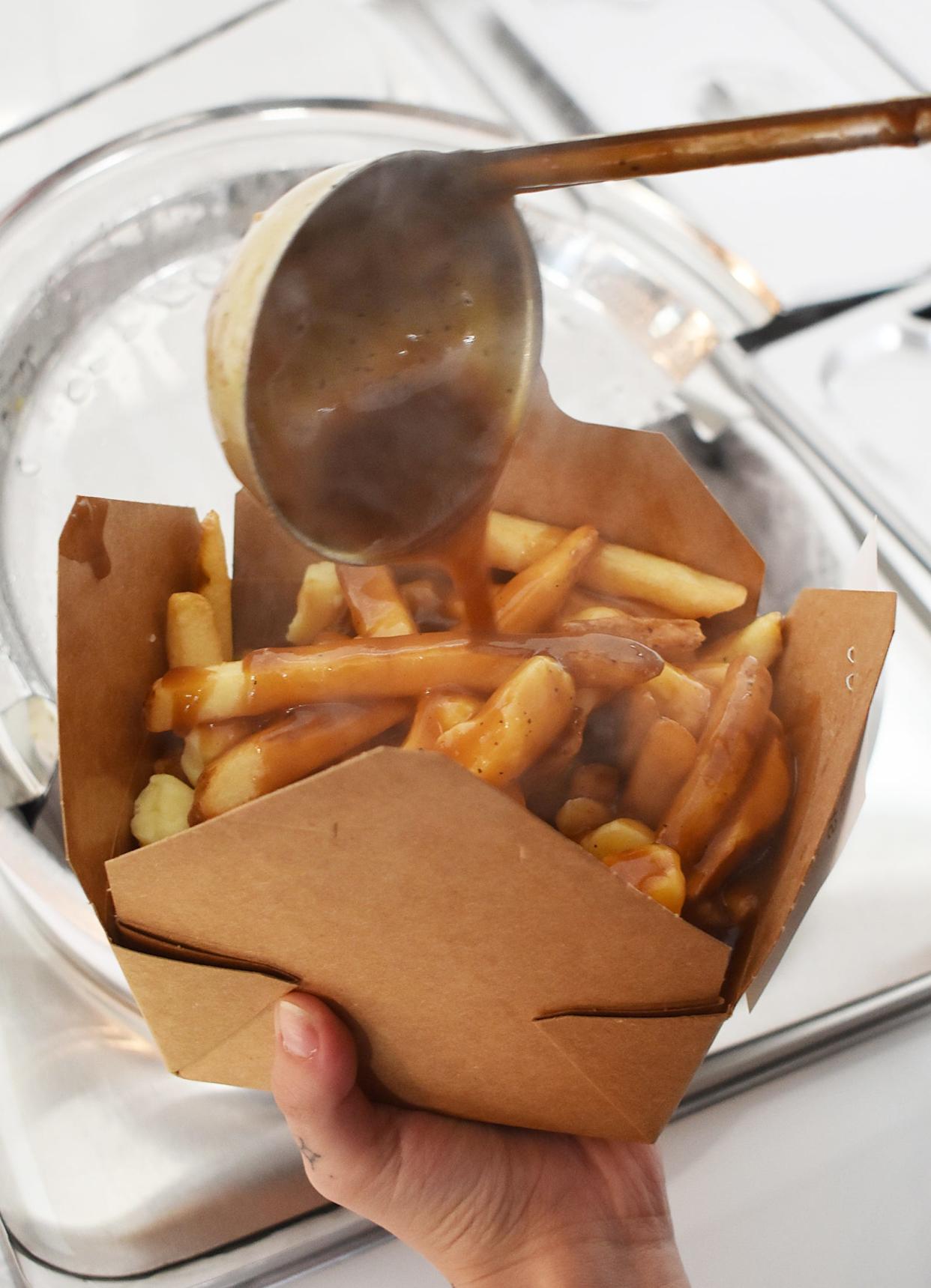 Gravy poured on an order of Poutine at the Krave Poutinerie at 486 Bedford St. in Fall River Friday May 3 2024.