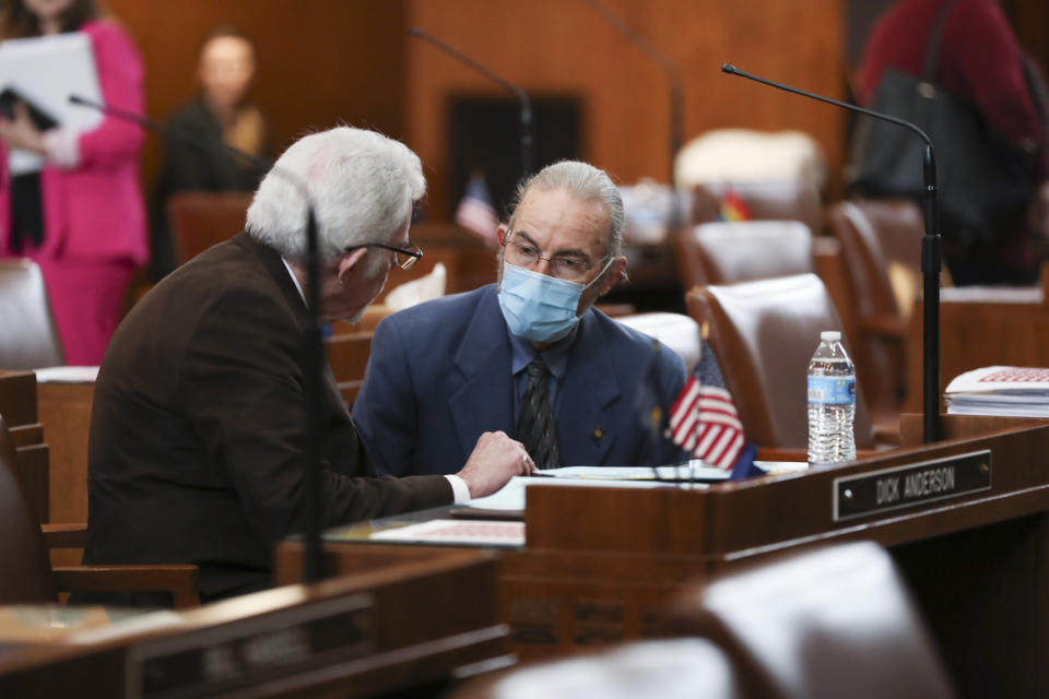 Republican Sen. Dick Anderson, left, speaks with Democratic Sen. Floyd Prozanski during a Senate session at the Oregon State Capitol in Salem, Ore., Thursday, May 4, 2023. Four Republican senators and one Independent senator had unexcused absences, preventing a quorum for the second day. (AP Photo/Amanda Loman)