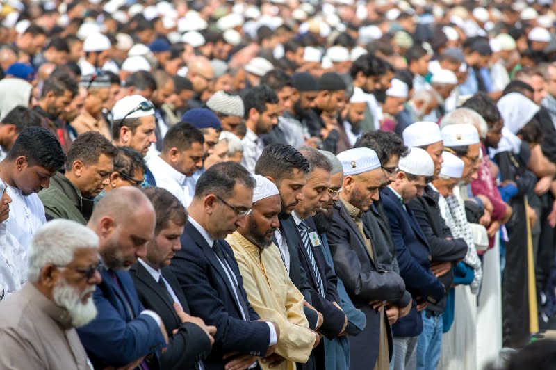 Muslims answer the call to pray at Hagley Park, opposite the Al Noor Mosque, in Christchurch, New Zealand, on March 22, 2019, one week after a series of mosque shootings left 51 people dead. File Photo by Martin Hunter/EPA-EFE