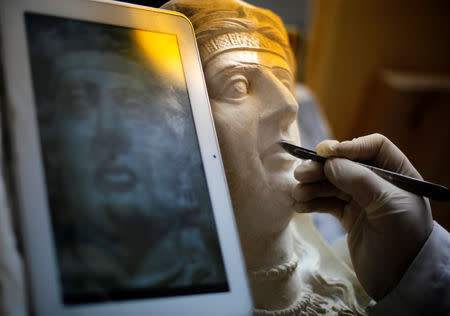 A specialist works on a damaged statue from Palmyra at Syria's National Museum of Damascus, Syria January 9, 2019. Picture taken January 9, 2019. REUTERS/Omar Sanadiki