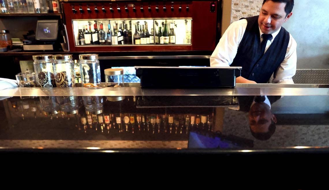 Juan Cordova works behind the bar at Mac’s on Main restaurant in Grapevine on Friday, April 5. Amanda McCoy/amccoy@star-telegram.com