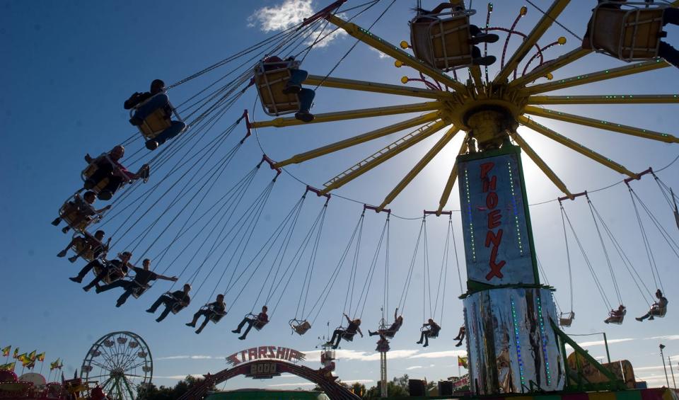 Fairgoers ride on the Phoenix on Wednesday, the opening day of the San Jaoquin County Fair in Stockton. CLIFFORD OTO/THE RECORD