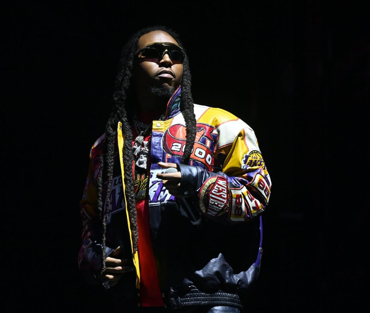 Takeoff performs onstage in Atlanta on Oct. 8, 2022. He was killed less than a month later. <a href="https://www.gettyimages.com/detail/news-photo/takeoff-performs-onstage-during-day-1-of-the-2022-one-news-photo/1431877751?phrase=takeoff%202022&adppopup=true" rel="nofollow noopener" target="_blank" data-ylk="slk:Paras Griffin/Getty Images;elm:context_link;itc:0;sec:content-canvas" class="link ">Paras Griffin/Getty Images</a>