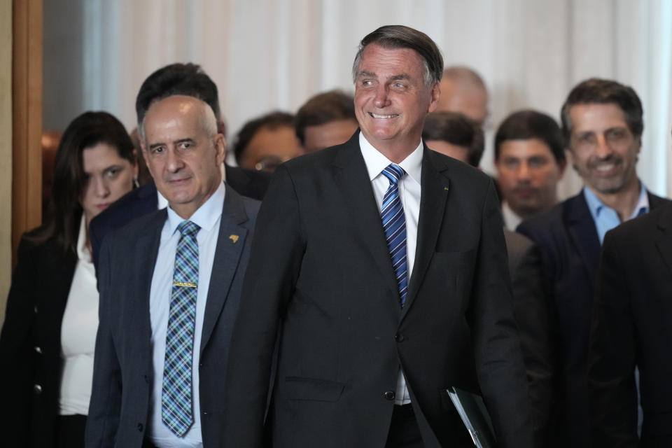 Brazilian President Jair Bolsonaro arrives to speak from his official residence of Alvorada Palace in Brasilia, Brazil, Tuesday, Nov. 1, 2022, the leader's first public comments since losing the Oct. 30 presidential runoff. (AP Photo/Eraldo Peres)