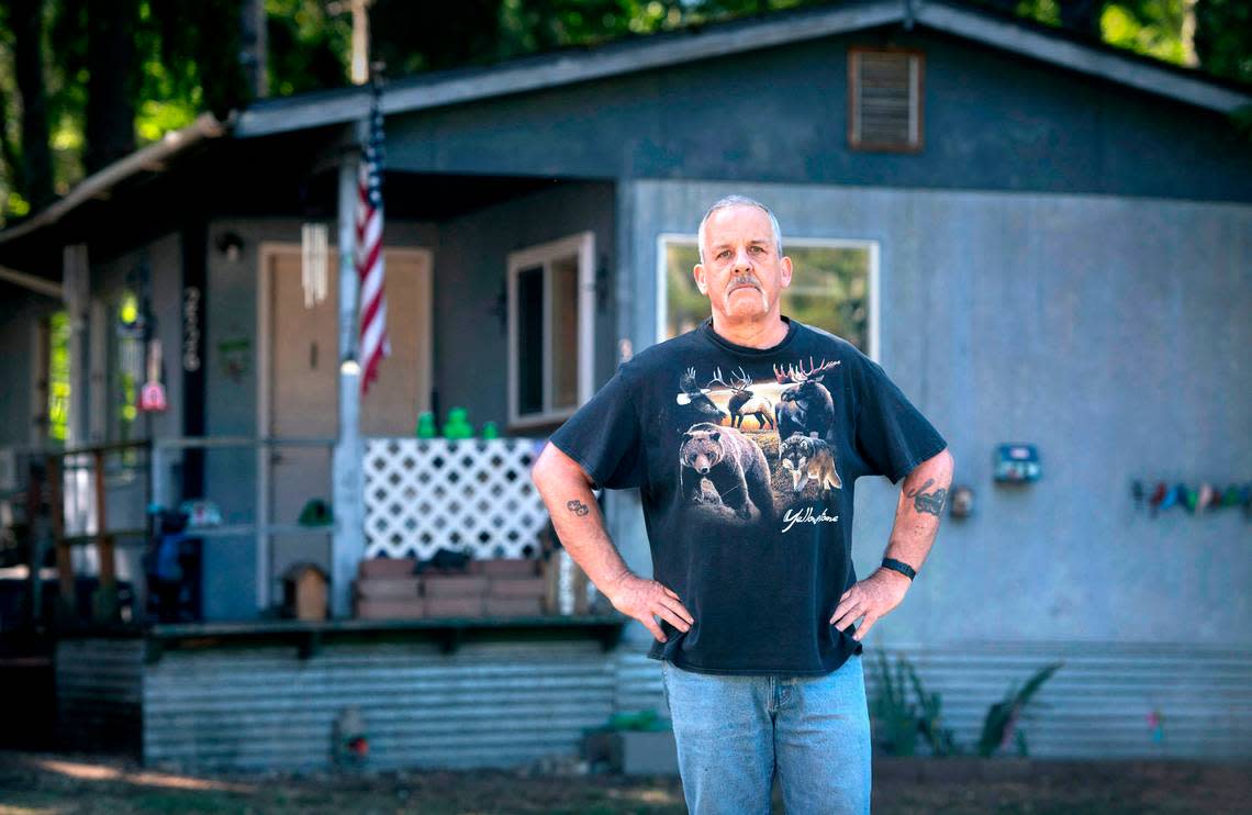 Patick Froslie stood up to his new property owner who insisted Froslie pay rent for his mobile home and tried to sell the home and have Froslie and his wife evicted. Froslie received a temporary protection order for his wife against the property owner, but “I think he still thinks he owns it,” he said. Froslie is shown outside his home at the Little Lake Mobile Home Park in Roy, Washington on Thursday, Sept. 8, 2022.