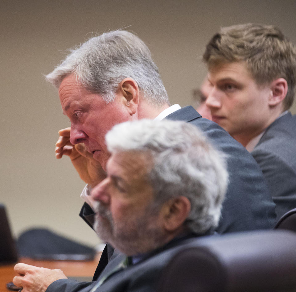 Former DeKalb County police officer Robert Olsen becomes emotional during his sentencing, Friday, Nov. 1, 2019, in Decatur, Ga.. Olsen, who was convicted of aggravated assault and other crimes in the fatal shooting of an unarmed, naked man, was sentenced Friday to 12 years in prison.. (Alyssa Pointer/Atlanta Journal-Constitution via AP)