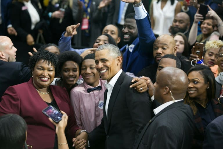 Former US president Barack Obama (C), at a rally for Georgia Democratic gubernatorial candidate Stacey Abrams (L), is taking on an increasingly prominent role at the close of midterm election campaigning during a moment of deep national division