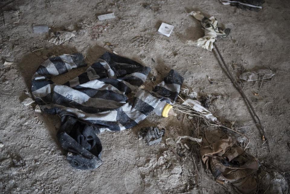 In this photo taken on Sunday, Dec. 4, 2016, a feeding bottle left behind at disused farm warehouse, near the train station of the Greek town of Didymoteicho, at the Greek-Turkish border. A year after the uncontrolled influx of more than a million refugees and economic migrants to debt-hobbled Greece, en route to Europe's prosperous heartland, this border region is again seeing rising migratory flows. (AP Photo/Giannis Papanikos)