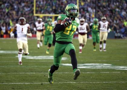 FILE - In this Jan. 1, 2015, file photo, Oregon wide receiver Darren Carrington scores against Florida State during the second half of the Rose Bowl NCAA college football playoff semifinal in Pasadena, Calif. Carrington did not travel with the Ducks to the national championship game, according to a person with knowledge of his absence. The person, who is traveling with the team, spoke to The Associated Press on Friday, Jan. 9, 2015, on condition of anonymity because the individual was not authorized to speak on the record. A spokesman for the team did not immediately respond to email inquiries seeking comment. (AP Photo/Lenny Ignelzi, File)