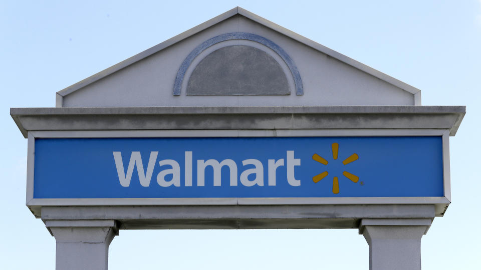 FILE - In this Sept. 3, 2019, file photo, a Walmart logo forms part of a sign outside a Walmart store, in Walpole, Mass. Walmart Inc. reports earnings Thursday, Nov. 14. (AP Photo/Steven Senne, File)