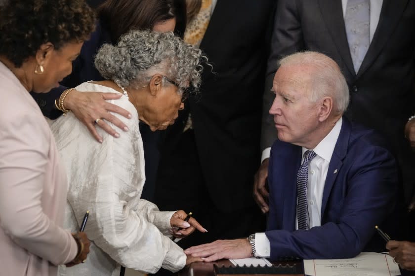 WASHINGTON, DC - JUNE 17: (L-R) Ninety-four-year-old activist and retired educator Opal Lee, known as the Grandmother of Juneteenth, speaks with U.S. President Joe Biden after he signed the Juneteenth National Independence Day Act into law in the East Room of the White House on June 17, 2021 in Washington, DC. The Juneteenth holiday marks the end of slavery in the United States and the Juneteenth National Independence Day will become the 12th legal federal holiday — the first new one since Martin Luther King Jr. Day was signed into law in 1983. (Photo by Drew Angerer/Getty Images)