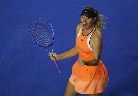 Russia's Maria Sharapova celebrates after winning her fourth round match against Switzerland's Belinda Bencic at the Australian Open tennis tournament at Melbourne Park, Australia, January 24, 2016. REUTERS/Jason O'Brien Action Images via Reuters