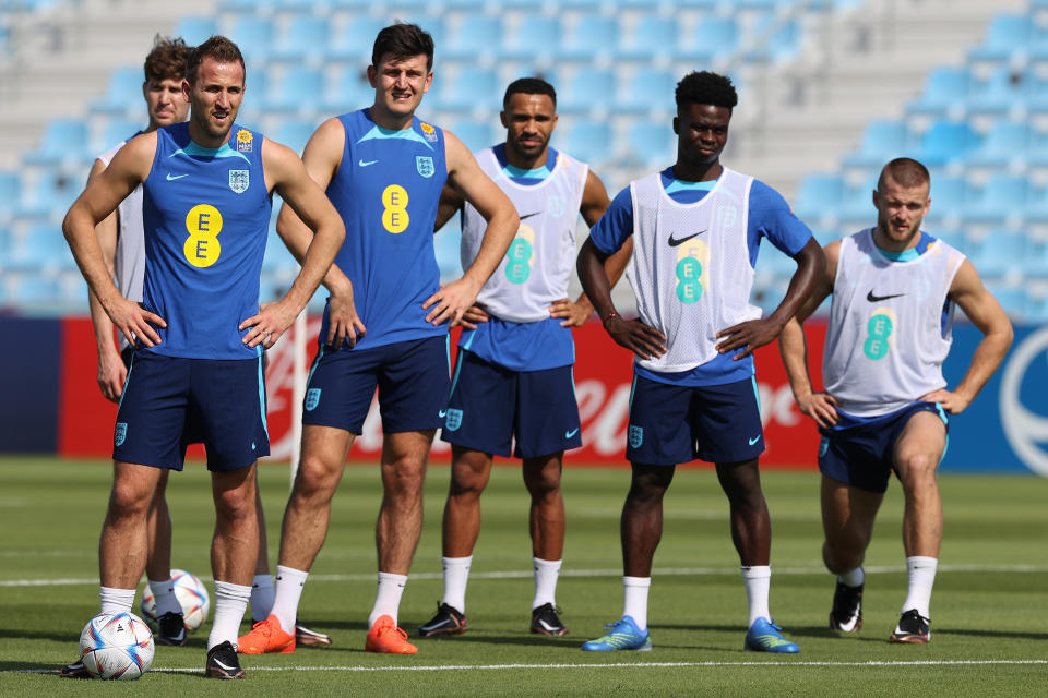 DOHA, QATAR - NOVEMBER 17: England captain Harry Kane (l) alongside John Stones, Harry Maguire , Callum Wilson, Bukayo Sako and Eric Dier during the England Press Conference at Al Wakrah Stadium on November 17, 2022 in Doha, Qatar. (Photo by Michael Steele/Getty Images)