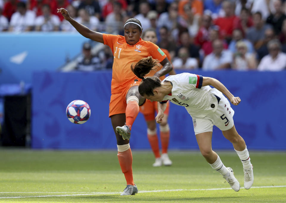 Netherlands' Lineth Beerensteyn, left, is challenged by United States' Kelley O Hara during the Women's World Cup final soccer match between US and The Netherlands at the Stade de Lyon in Decines, outside Lyon, France, Sunday, July 7, 2019. (AP Photo/David Vincent)