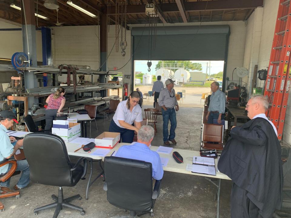 St. Johns Improvement District's Marjorie Hale prepares papers at the board table for the district's annual meeting May 11, 2020 at the district's shop, 955 122nd Avenue SW, Indian River County.