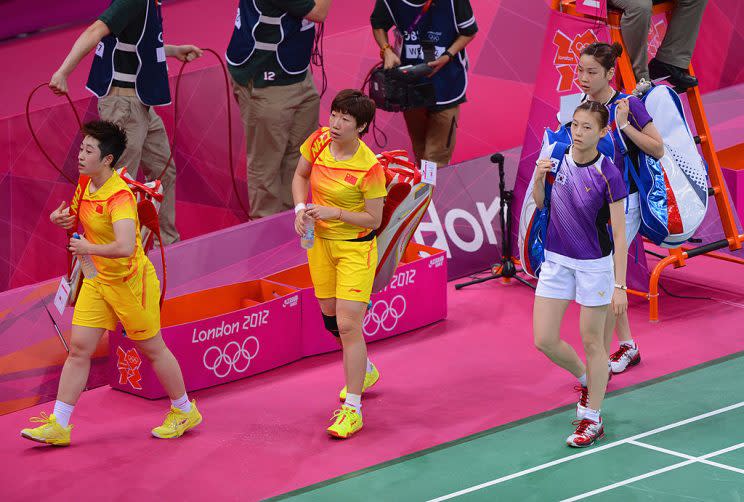 Wang Xiaoli and Yang Yu of China leave the court with Ha Na Kim and Kyung Eun Jung of Korea after their Women's Doubles Badminton on Day 4 of the London 2012 Olympic Games at Wembley Arena on July 31, 2012 in London, England. (Photo by Michael Regan/Getty Images)