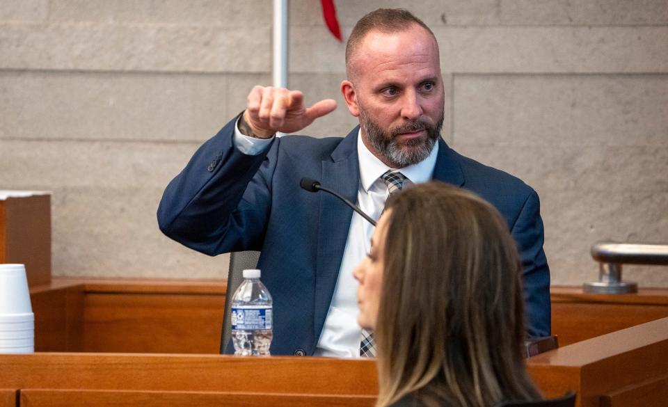 Former Franklin County Sheriff's deputy Jason Meade demonstrated on the stand Tuesday, Feb. 6, 2024, how he alleges Casey Goodson Jr. was handling a gun while driving his car. Meade is on trial in Franklin County Common Pleas Court for murder and reckless homicide in connection with the shooting death of Goodson on Dec. 4, 2020.