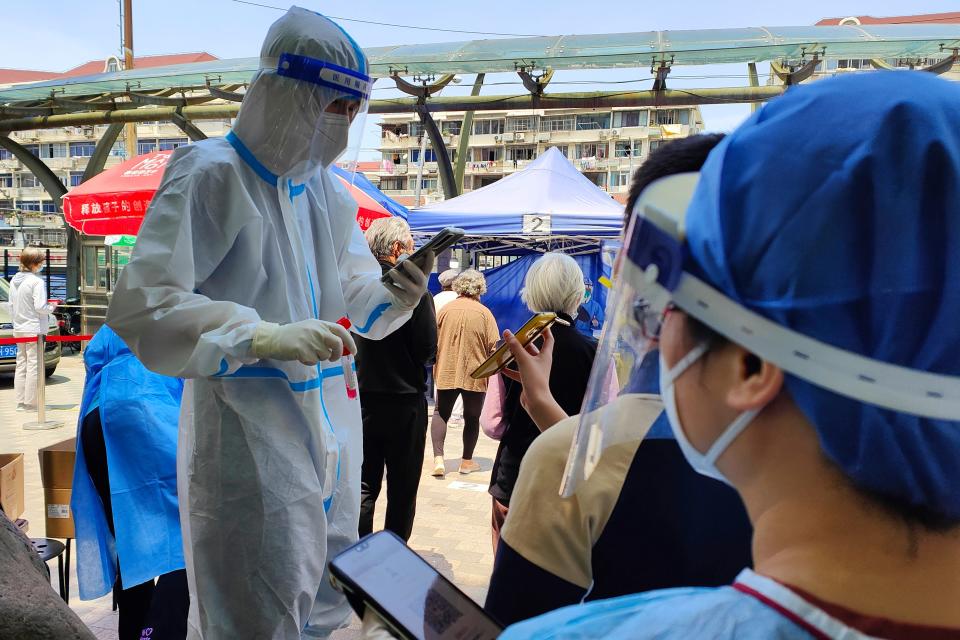 People queue for Covid-19 tests in Shanghai, China.