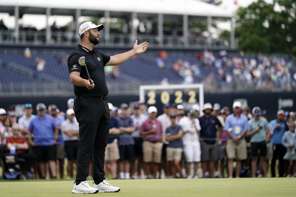 Jon Rahm, of Spain, reacts after missing a putt on the 15th hole during the first round of the U.S. Open golf tournament at The Country Club, Thursday, June 16, 2022, in Brookline, Mass. (AP Photo/Julio Cortez)