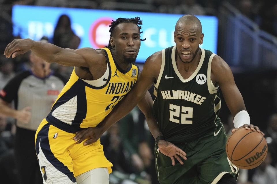 Milwaukee Bucks' Khris Middleton tries to get past Indiana Pacers' Aaron Nesmith during the first half of Game 5 of the NBA playoff basketball series Tuesday, April 30, 2024, in Milwaukee. (AP Photo/Morry Gash)