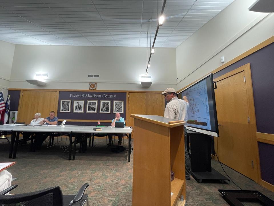 Brent Wise, an adjoining property owner to the meditation retreat center for which Saloua Lahllou applied for a special use permit, points to a site plan for the retreat center, Dreamers Way.