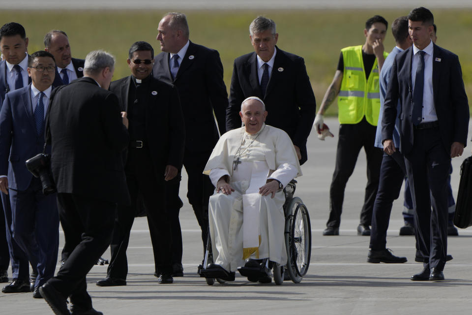 Pope Francis arrives at Ulaanbaatar's International airport Chinggis Khaan, Friday, Sept. 1, 2023. Pope Francis is traveling to Mongolia to encourage one of the world's smallest and newest Catholic communities. It's the first time a pope has visited the Asian country and comes at a time when the Vatican's relations with Mongolia's two powerful neighbors, Russia and China, are once again strained. (AP Photo/Ng Han Guan)