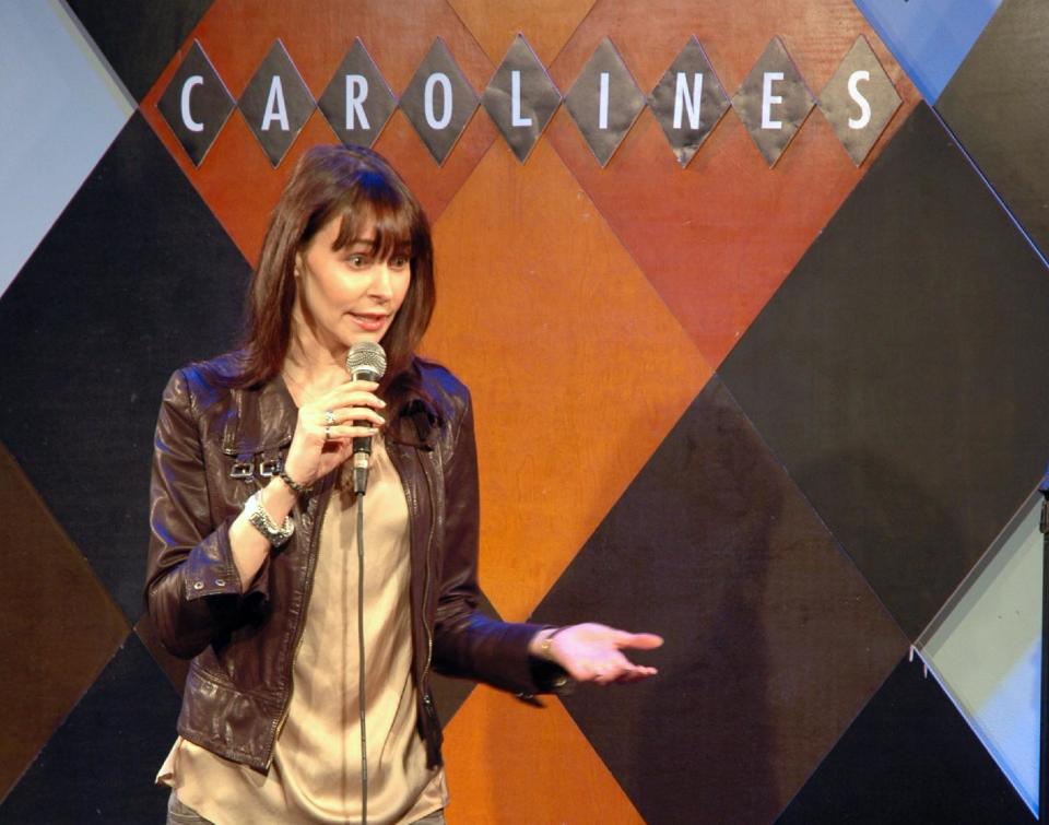 This Feb. 9, 2014 photo shows Ella Steinbeck performing at a standup comedy show at Caroline's Comedy Club in New York after taking a six-week class in standup comedy. The $395 course, held at a nearby acting studio, culminates with a graduation performance at the club for friends and family. (AP Photo/Lawrence Roberts)