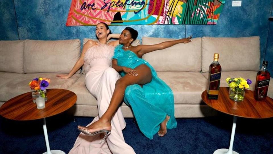 Lily James, left, and Simone Ashley laugh it up as Johnnie Walker Celebrates the 2023 Vanity Fair Oscar Party at Wallis Annenberg Center for the Performing Arts in Beverly Hills. (Presley Ann/Getty Images for Vanity Fair)