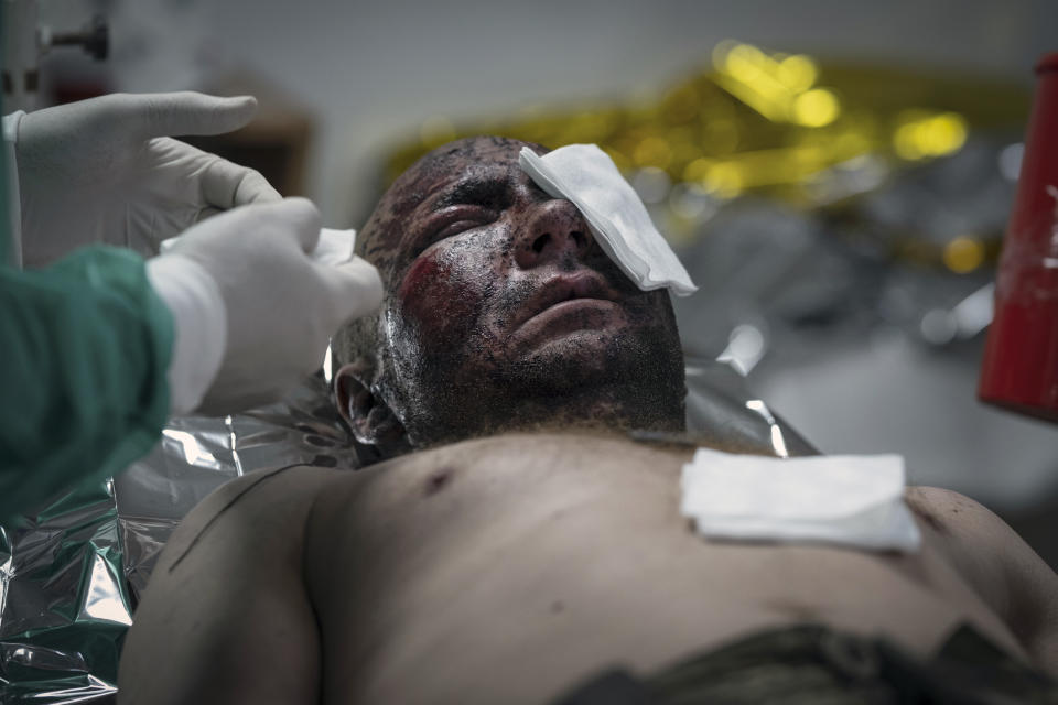 Military medics give first aid to a wounded Ukrainian soldier at a medical stabilisation point near Bakhmut, Donetsk region, Ukraine, Friday, May 24, 2024. (Iryna Rybakova via AP)