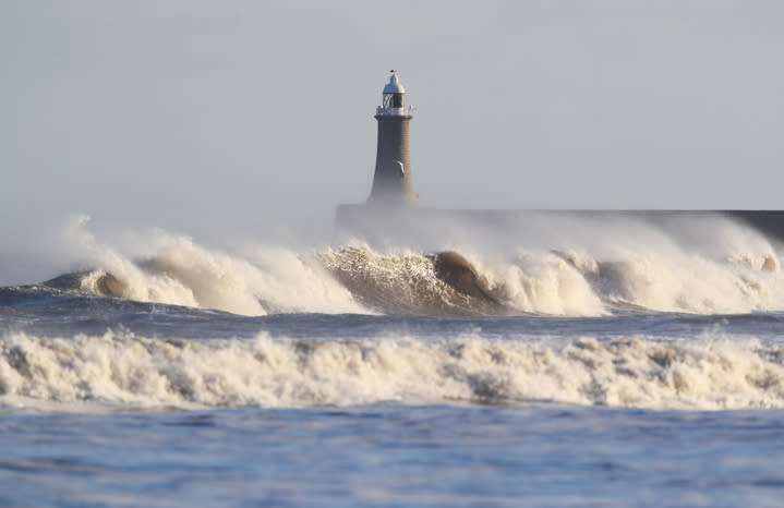 The weather warning about high winds, such as seen here in Tynemouth earlier this year, will remain in place on Saturday (PA)