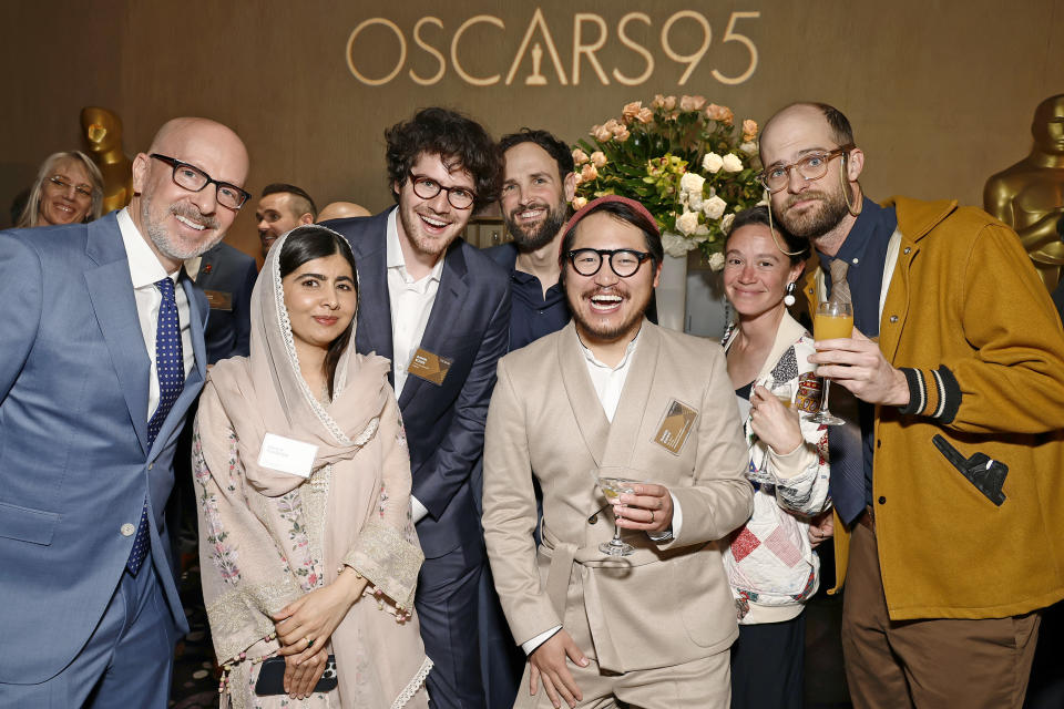 Joshua Seftel, Malala Yousafzai, Daniel Roher, Shane Boris, Daniel Kwan, guest, and Daniel Scheinert attend the 95th Annual Oscars Nominees Luncheon - Credit: Frazer Harrison/Getty Images