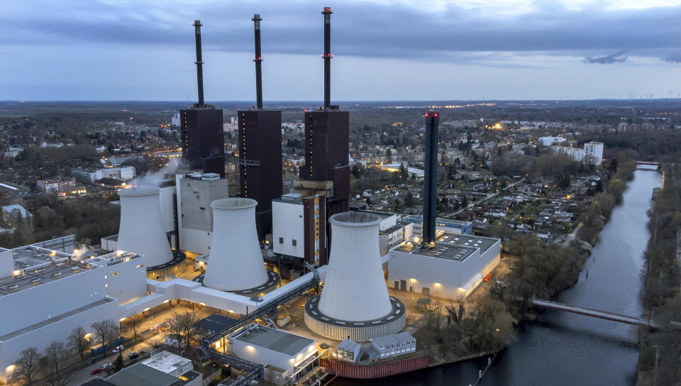 Steam leaves a cooling tower of the Lichterfelde gas-fired power plant in Berlin, Germany, Wednesday, March 30, 2022. Germany and Austria have activated early warning plans amid concerns that Moscow could cut natural gas deliveries. Together with France, they also urged consumers to conserve energy. (AP Photo/Michael Sohn)