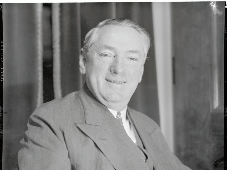 James Michael Curley smiles for a portrait in 1935.