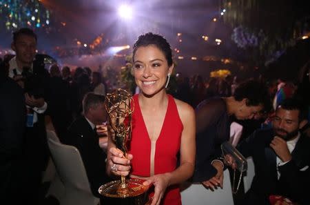 Actress Tatiana Maslany holds her award for Outstanding Lead Actress In A Drama Series for "Orphan Black" as she mingles at the Governors Ball after the 68th Primetime Emmy Awards in Los Angeles, California U.S., September 18, 2016. REUTERS/Lucy Nicholson