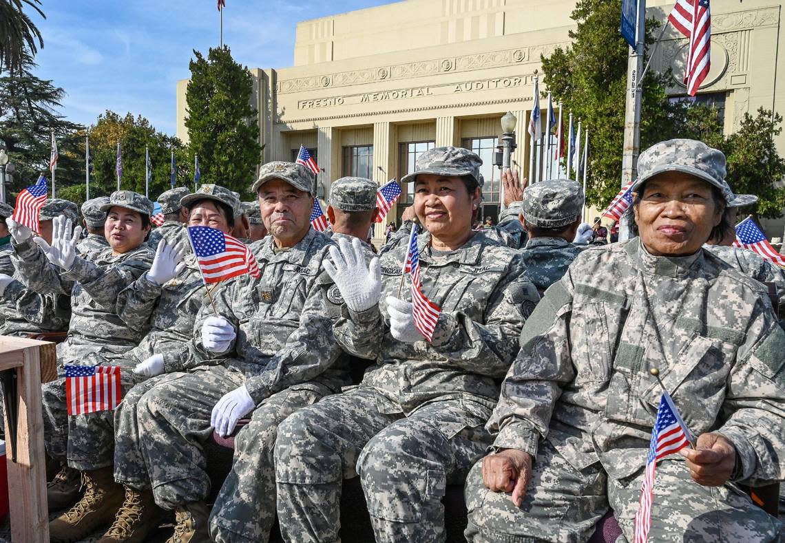 Hmong veterans ride on a Joint Military Assistance Command float in front of the Fresno Memorial Auditorium during the annual Veterans Parade in downtown Fresno on Friday, Nov. 11, 2022. CRAIG KOHLRUSS/ckohlruss@fresnobee.com