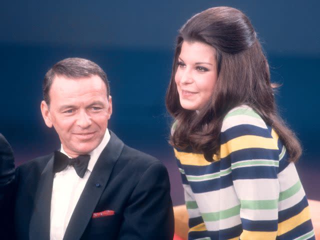 <p>Martin Mills/Getty</p> Frank Sinatra and his daughter Tina Sinatra sing during the taping of 'The Dean Martin Variety Show' circa 1967.